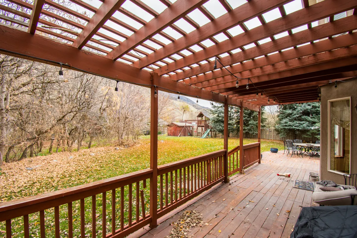 Wooden deck with autumn leaves in Old Millard, Omaha