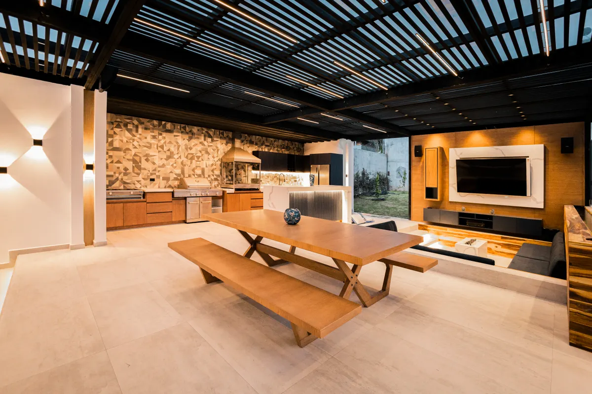 Outdoor kitchen and living space with wood-accented stained decking, Omaha