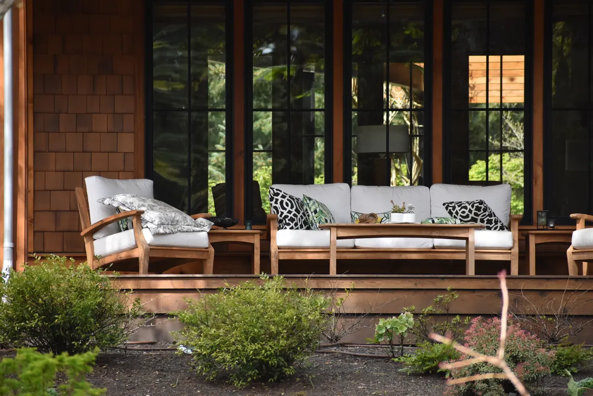 Multi-level wooden deck with furniture in Trendwood, Millard