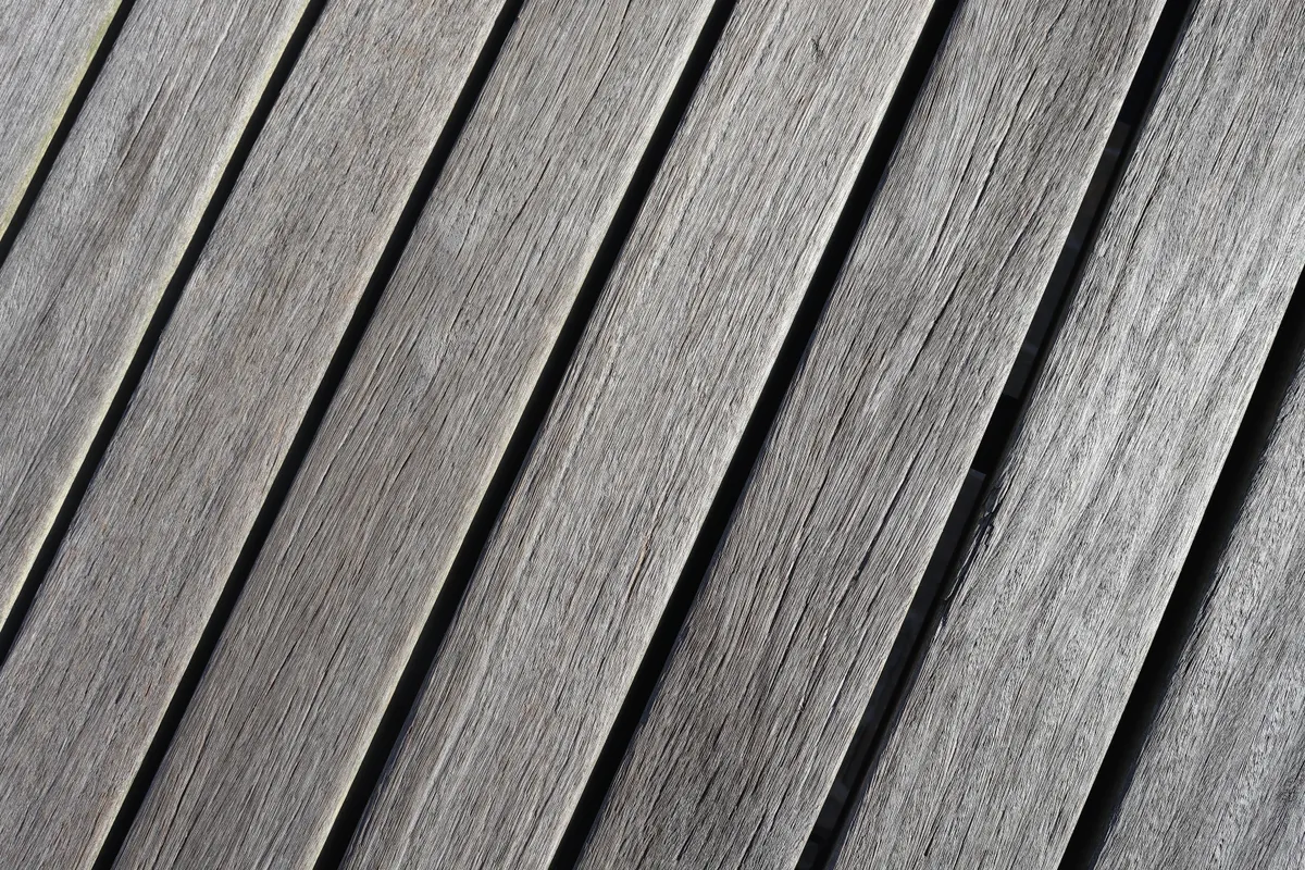 Close-up of weathered wooden deck boards showing grain and wear, Papillion