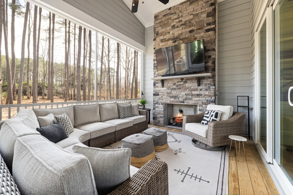 Outdoor composite patio with stone fireplace and modern furniture, Sarpy County
