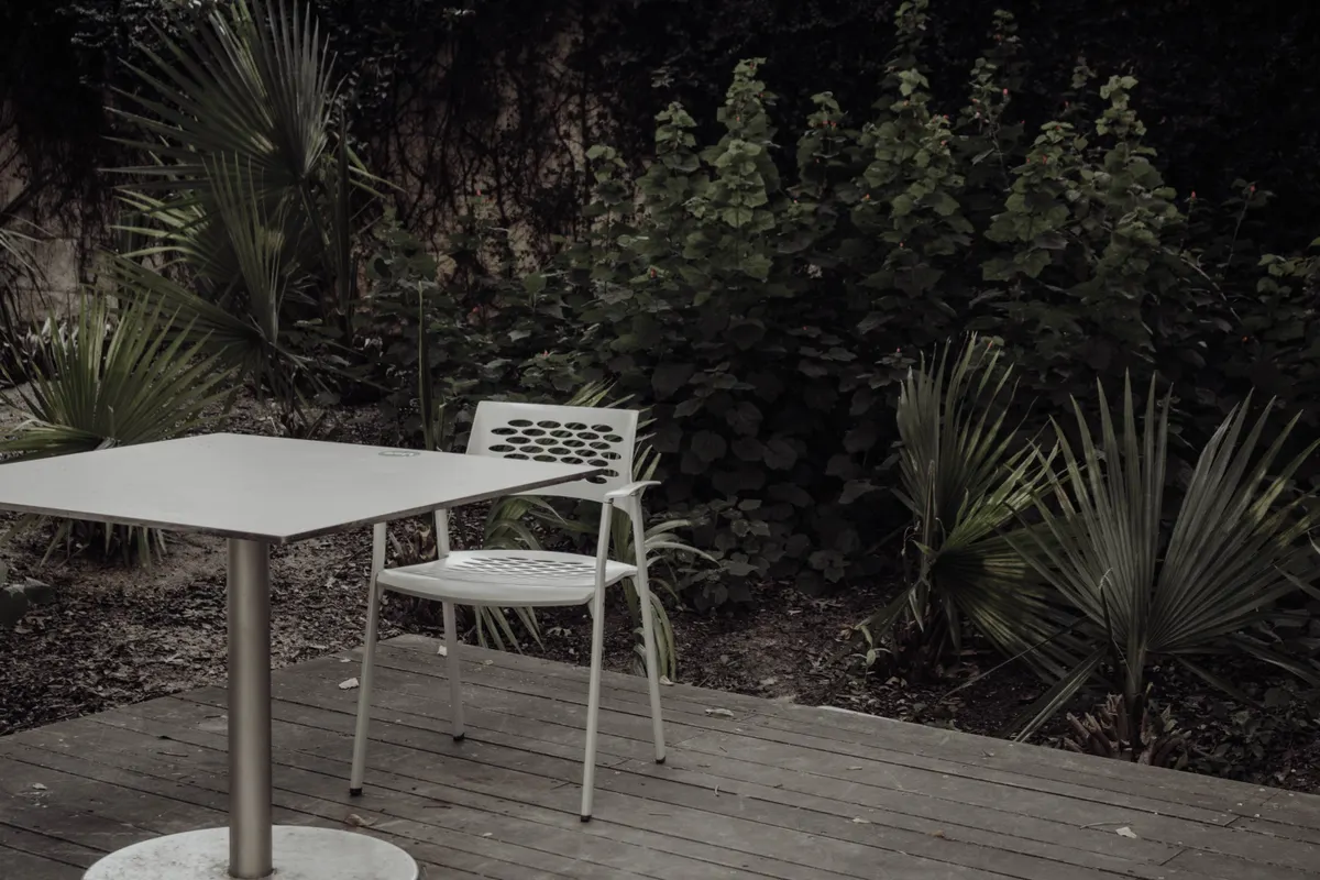 Tranquil outdoor deck setting with sealed wood chair and table, Omaha metro