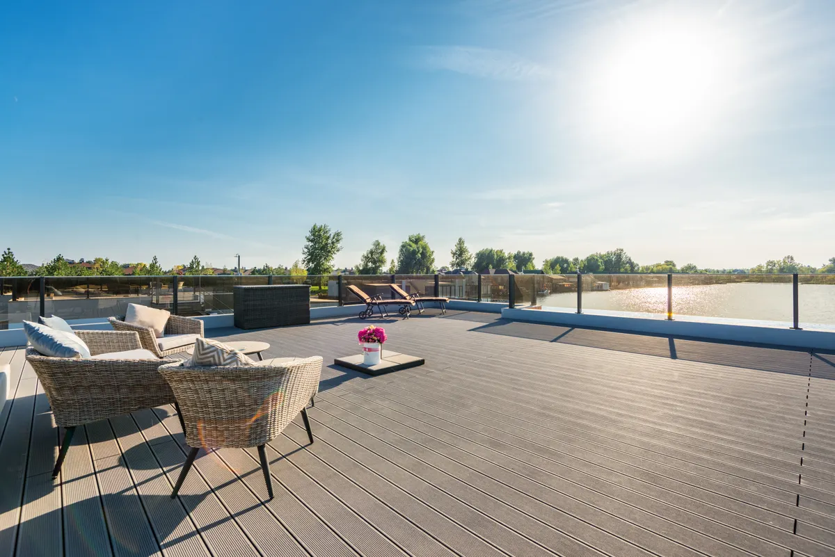 Spacious composite deck with outdoor furniture and a lounging area