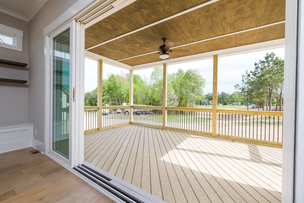 Spacious veranda with stained wood decking connecting indoor and outdoor space, Douglas County